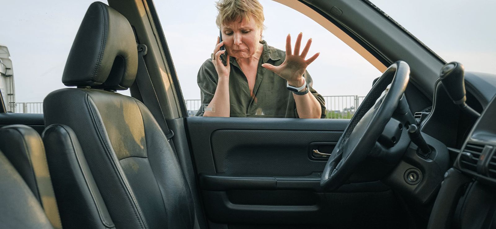 Automotive locksmith helping with a car lockout