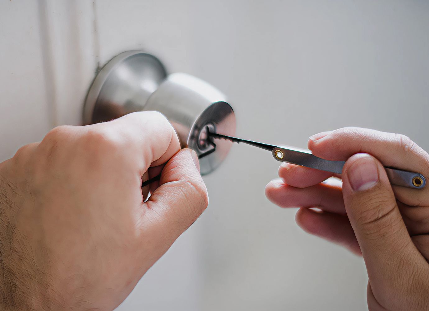 Residential locksmith opening a home door